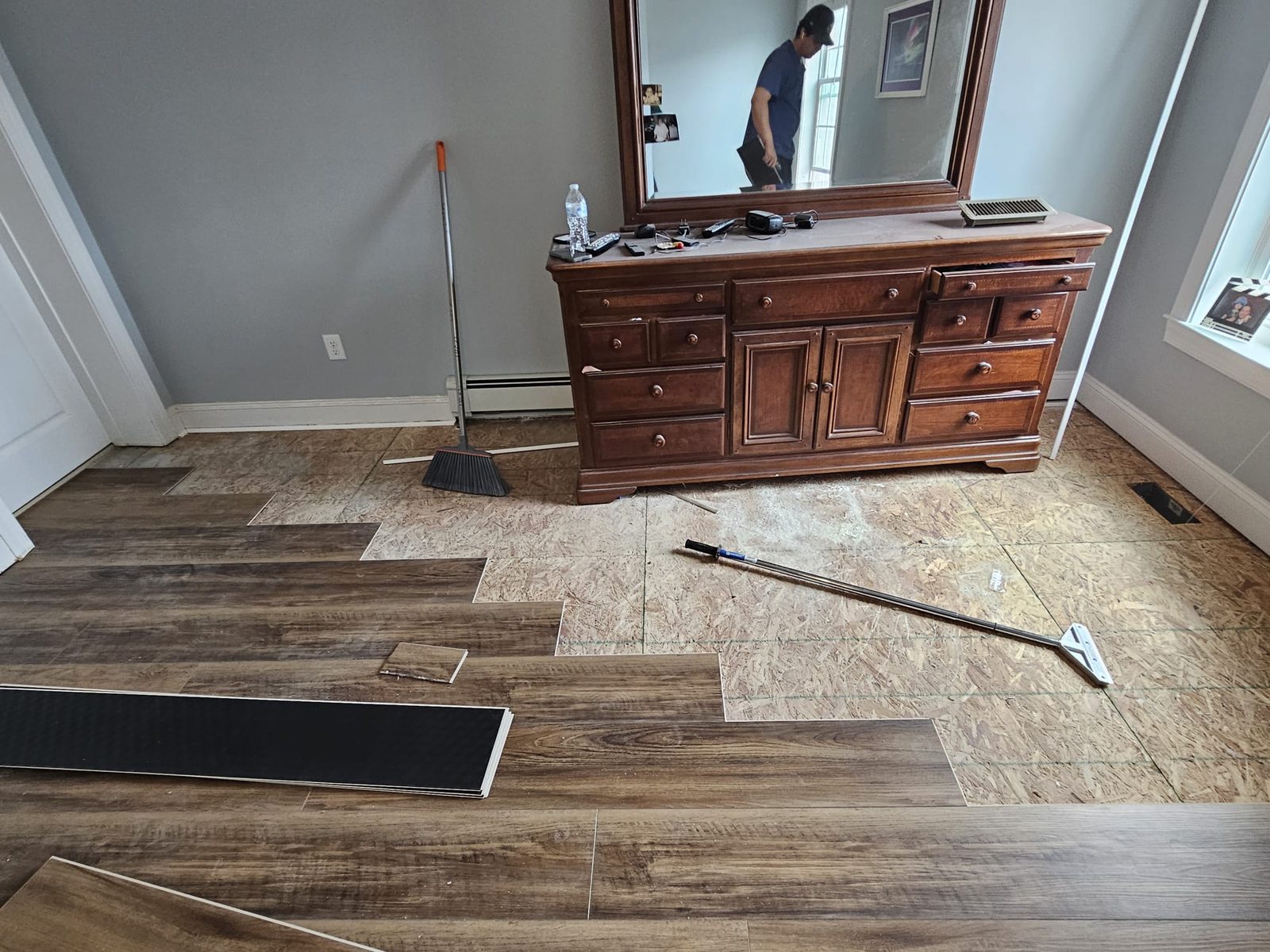 Luxury vinyl plank flooring being installed plank by plank in a Toms River, NJ home