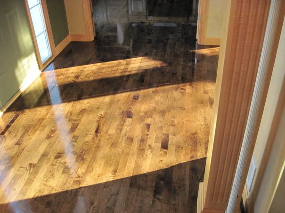 Refinished hardwood floor with a warm gloss finish in a New Jersey home