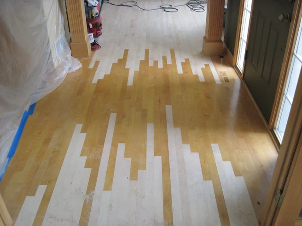 Hardwood floor repair in progress before refinishing in New Jersey
