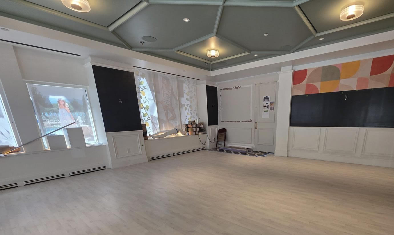 Large open room with new light wood-look flooring in Toms River, NJ