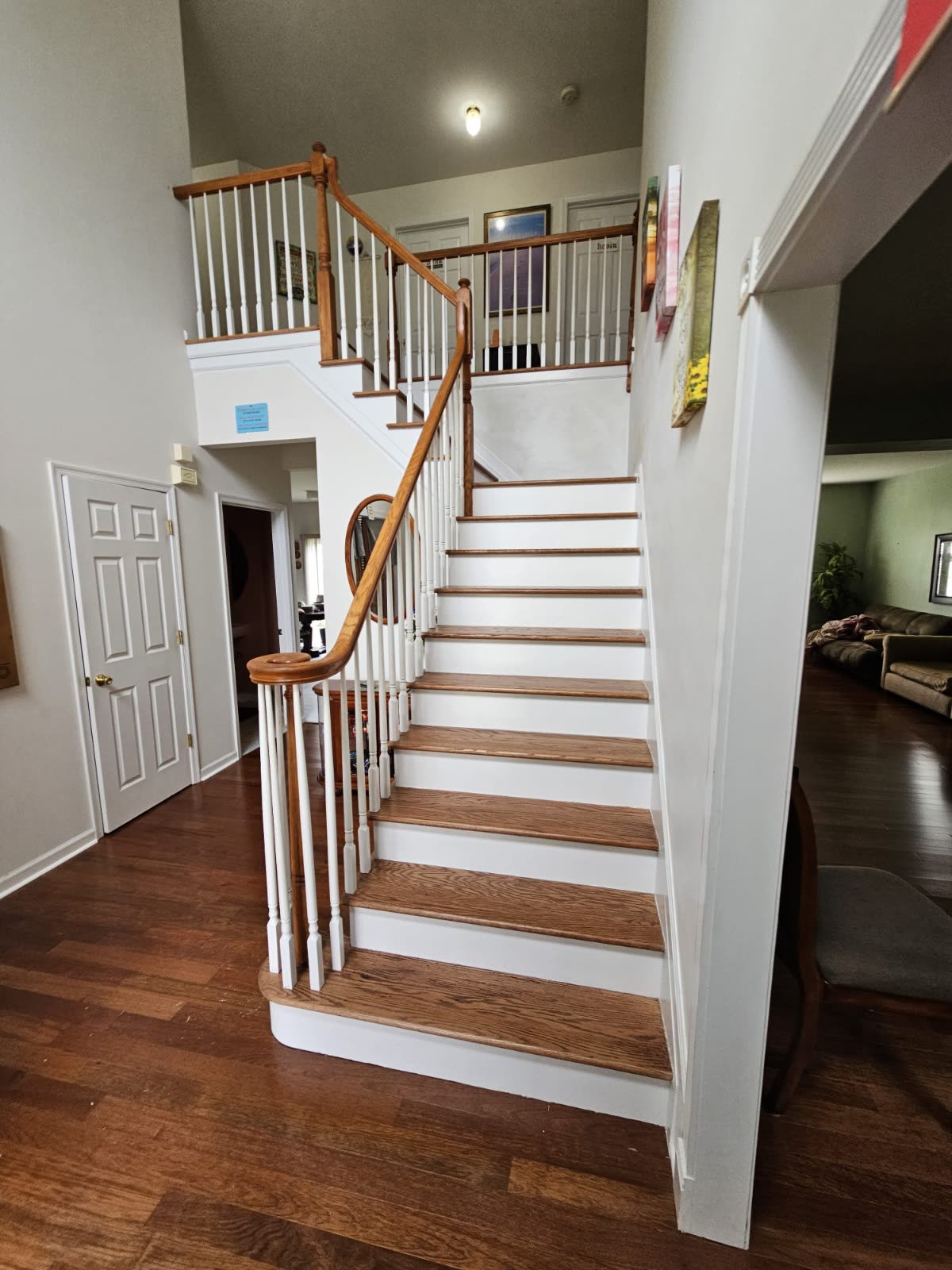 Finished hardwood staircase with matching wood treads and white risers in a New Jersey home