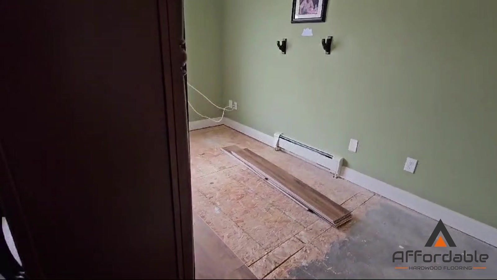 Wood-look flooring installation in progress over the subfloor in a Toms River, NJ bedroom