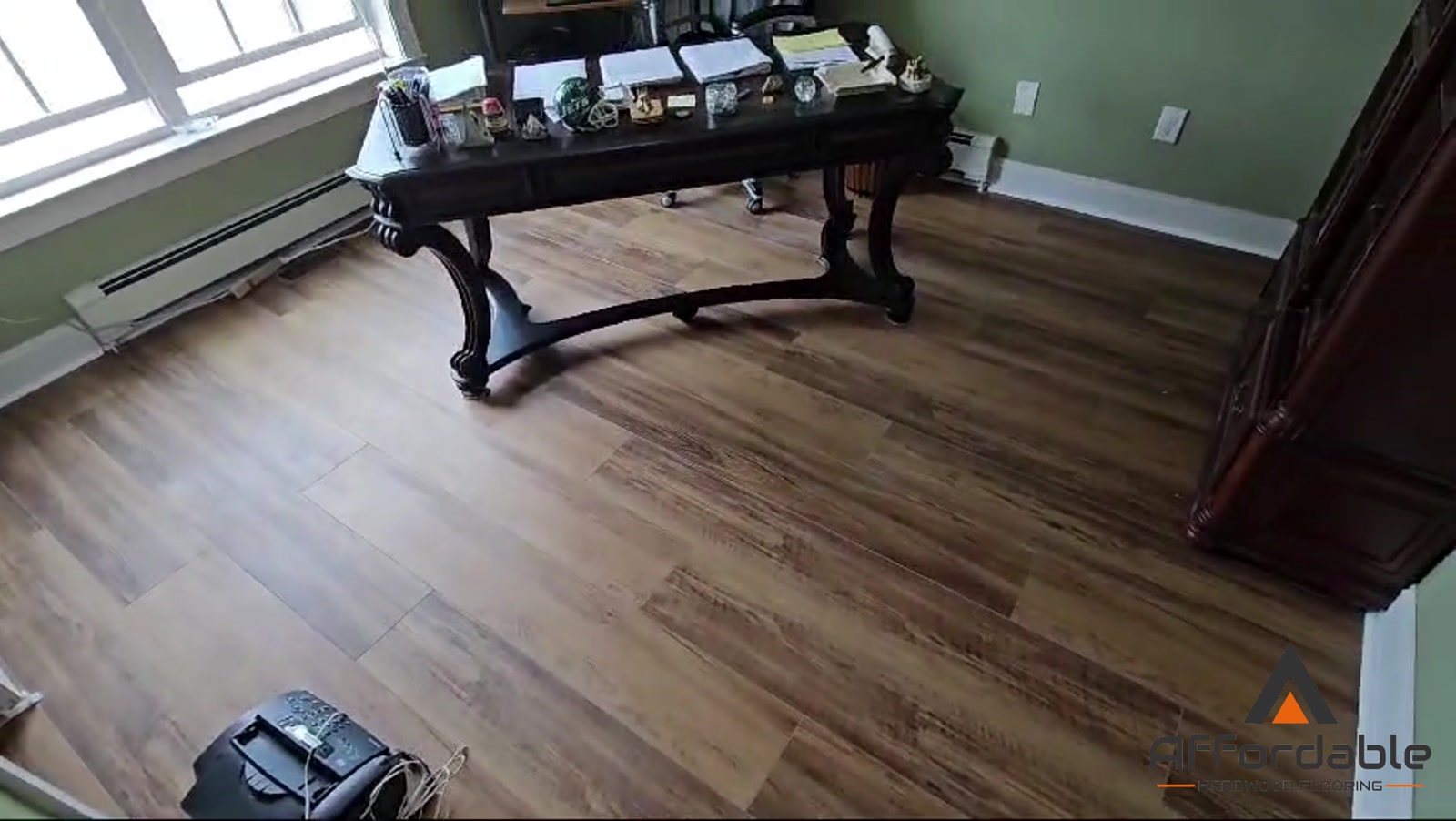 Home office with a desk on newly installed wood-look flooring in Toms River, NJ