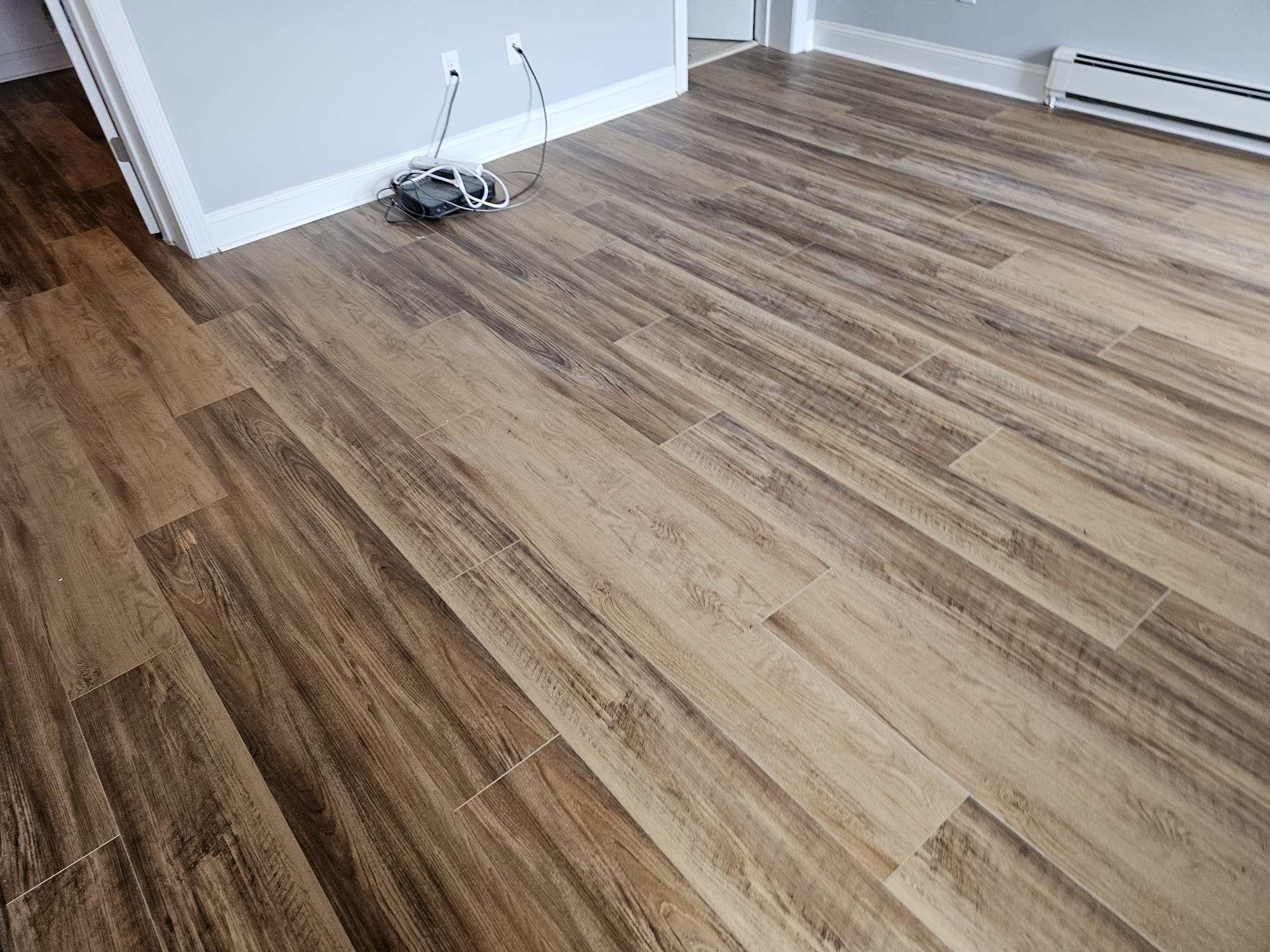 Vinyl plank flooring with baseboard heating in an Ocean County, NJ home